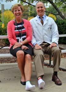 Kris Hering, Chief Nursing Officer and Dr. Joffe at Speare helping raise awareness for PAD by wearing one white sock