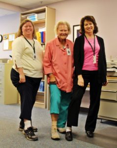 medical records team members at Speare helping raise awareness for PAD by wearing one white sock