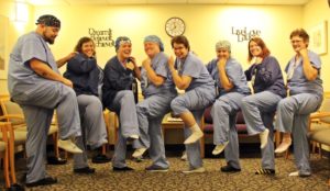 operating room team members at Speare helping raise awareness for PAD by wearing one white sock