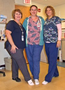 radiology team members at Speare helping raise awareness for PAD by wearing one white sock