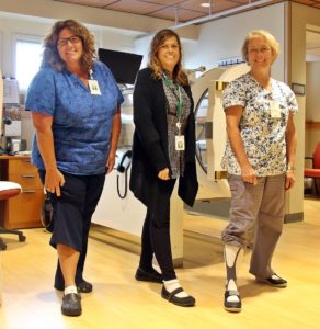 woundcare team members at Speare helping raise awareness for PAD by wearing one white sock