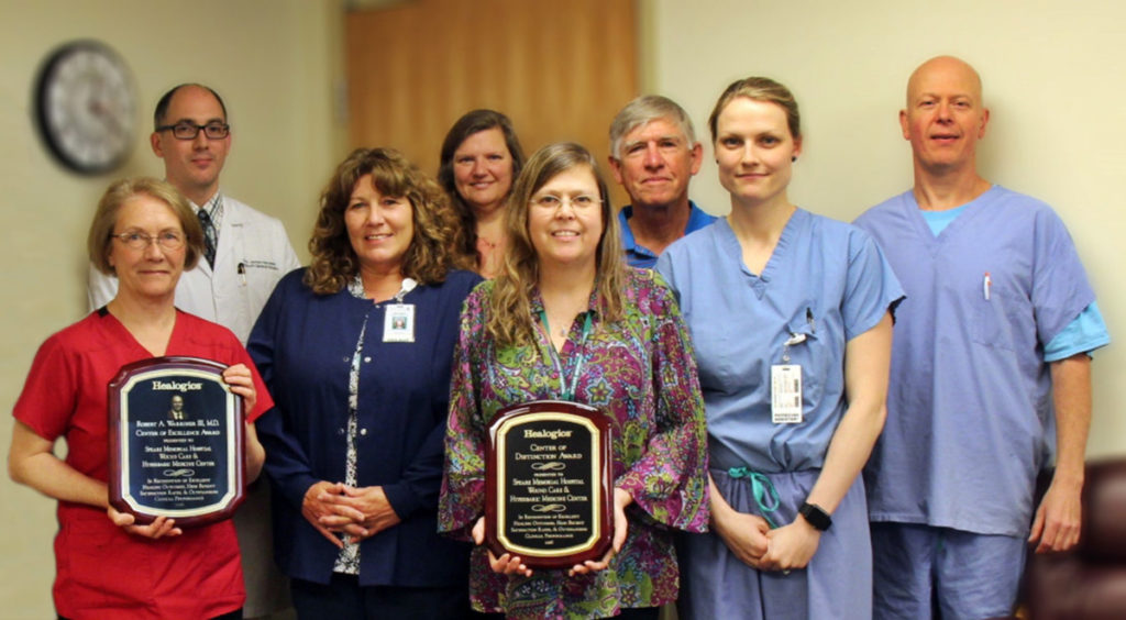 (From L R) Alison Lovett RN, Dr. James Hanowell, Deanna Brodie LPN, Rebecca Sayre Clinical Program Director, Linda Drew, Dr. John Bentwood, Rebekah Sexton PA C, and Dr. Jim Koren Medical Director