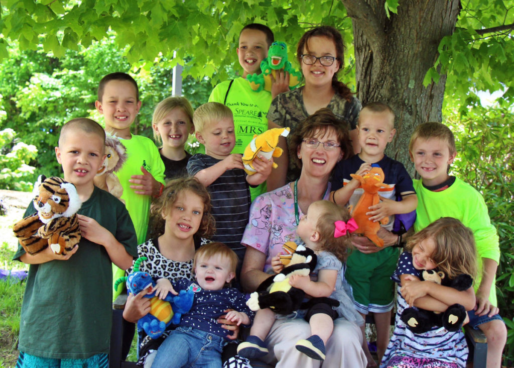 local area children with Dental Hygeniest, Ruth Doane of Speare Community Dental Health program use this