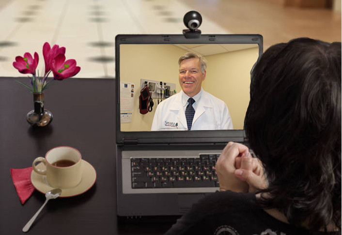 telehealth on computer with dr capron 1
