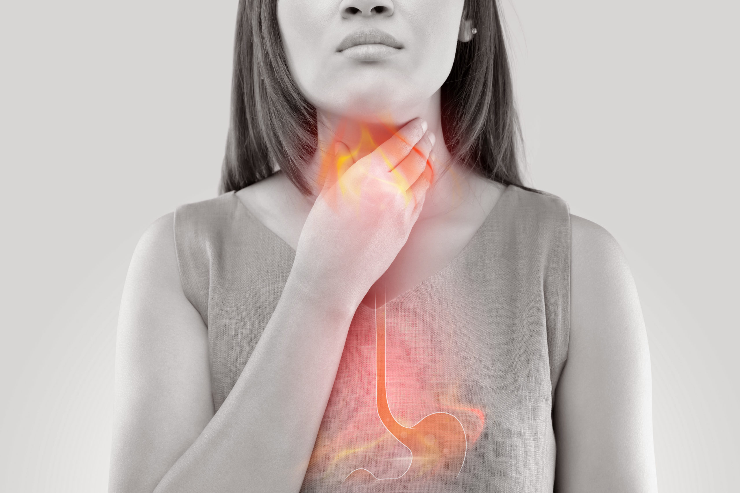 Woman Suffering From Acid Reflux Or Heartburn